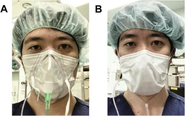 This clinical photograph displays a side-by-side comparison (Panel A and B) of two different supplemental oxygen delivery methods used in conjunction with a surgical mask, specifically discussed in the context of COVID-19 infection prevention. In both images, a healthcare provider is shown wearing a green bouffant surgical cap and a blue scrub top. Panel A demonstrates an oxygen mask applied over a white pleated surgical mask, representing a method to prevent aerosol dispersal during post-extubation. Panel B illustrates an alternative method where a nasal cannula is worn underneath a surgical mask, with the tubing exiting from the bottom of the mask. The images compare the layering of respiratory protection and oxygen delivery devices, highlighting clinical protocols aimed at maintaining oxygenation (FiO2) while providing an inhibitory barrier against respiratory droplets in a high-risk environment such as an intensive care unit (ICU) or operating room.