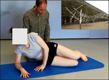 A clinical photograph illustrating a patient performing spinal stabilization exercises according to the Lyon method for scoliosis management. The image shows a female patient in a side-lying posture on a blue exercise mat. She is supported by her right forearm and left hand, with her torso partially elevated to engage core and paraspinal musculature. Her hips and knees are flexed in a stable, stacked arrangement. A physical therapist is positioned behind the patient, providing supervision and tactile guidance to ensure correct spinal alignment and trunk positioning. The exercise focuses on active stabilization, proprioception, and the correction of scoliotic curves through muscle activation and postural awareness. The background features a plain wall and an inset image showing tree-like architectural structures, which likely serves as a visual aid or context for the Lyon school's setting. This material is designed for physical therapy education, specifically demonstrating Conservative Management of Spinal Deformities (CMSD) through Physiotherapy Scoliosis-Specific Exercises (PSSE).