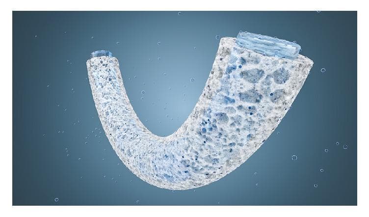 A schematic diagram representing a tubular, U-shaped porous sponge designed for gas-liquid exchange, modeled after physiological systems like lung alveoli or blood vessels. The illustration highlights a high-porosity structural wall with a heterogeneous network of interconnected pores of varying sizes. The sponge material is shown in a light, fiber-like texture, with visible blue-tinted gas bubbles or fluid droplets penetrating and diffusing through the porous walls. Both ends of the tubular structure are sealed with a translucent blue material, suggesting the containment of an inner aqueous solution or reaction channel. The educational focus of this visual is the demonstration of gas diffusion mechanisms across semi-permeable, virtually wall-less containers, applicable in biomedical engineering for respiratory support systems or controlled mineralization studies. The diagram illustrates how the hierarchical pore structure increases surface area for efficient gas-liquid interface reactions while maintaining mechanical stability.